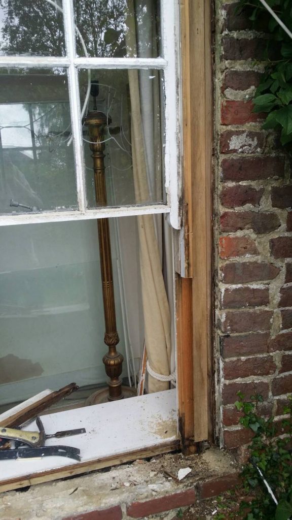 Sash window sill removed and exposed damage right through to the inside