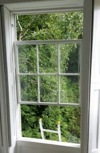 Timber sash window rebuilt after undercoating to avoid damage to gloss