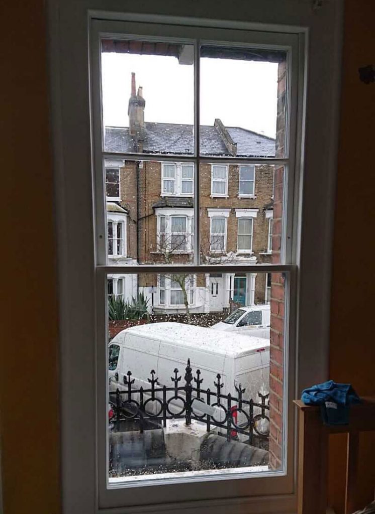 Original sash window double glazed and built back in situ with a draught proofing system