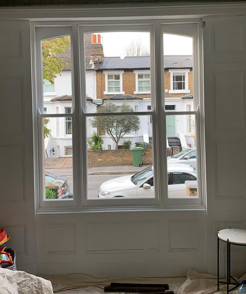 New arched double glazed Venetian sash windows offered in and ready for fitting